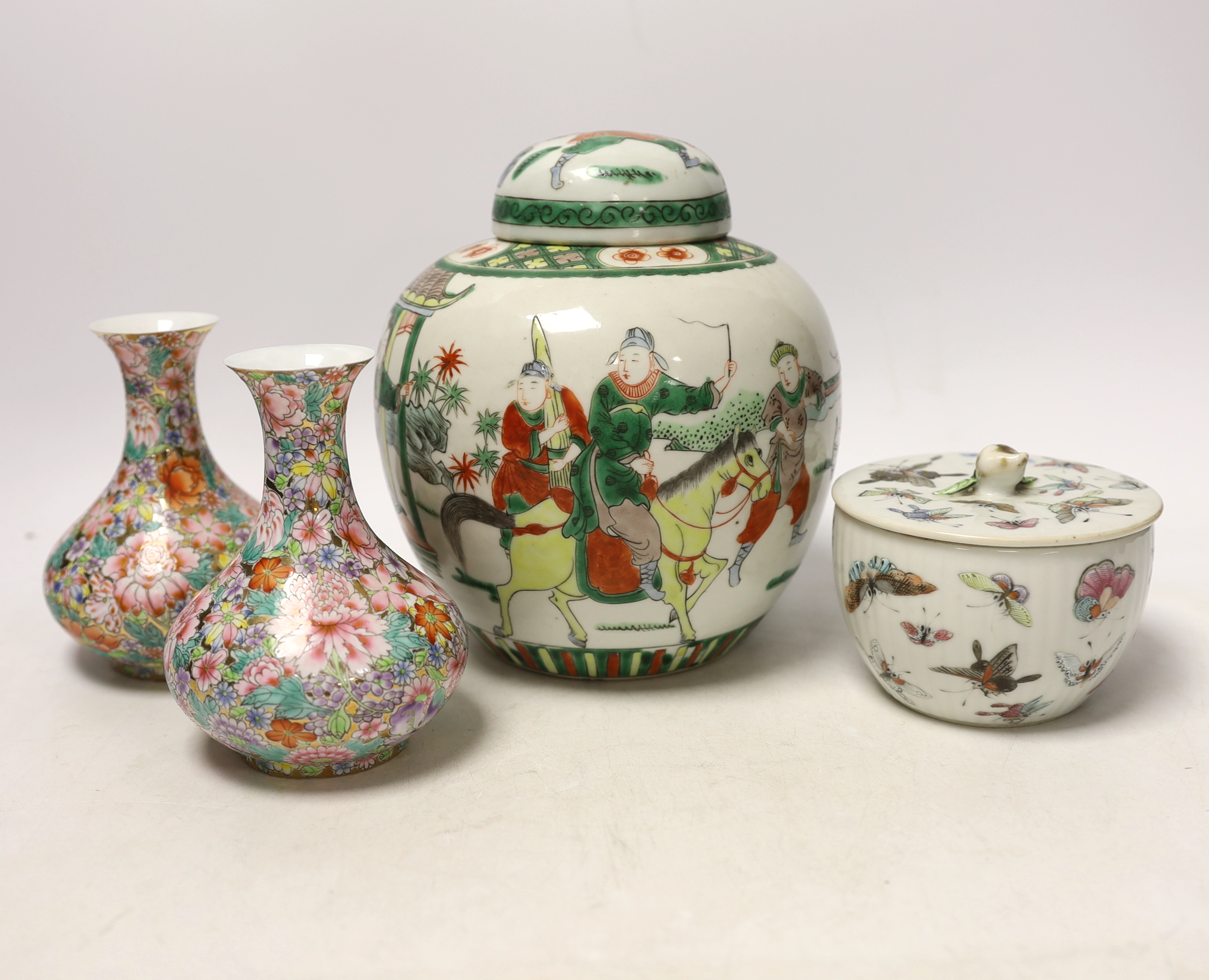 A Chinese famille rose 'butterfly' bowl and cover, Tongzhi mark and period, a famille verte jar and a pair of millefleur vases, tallest 19cm (4)